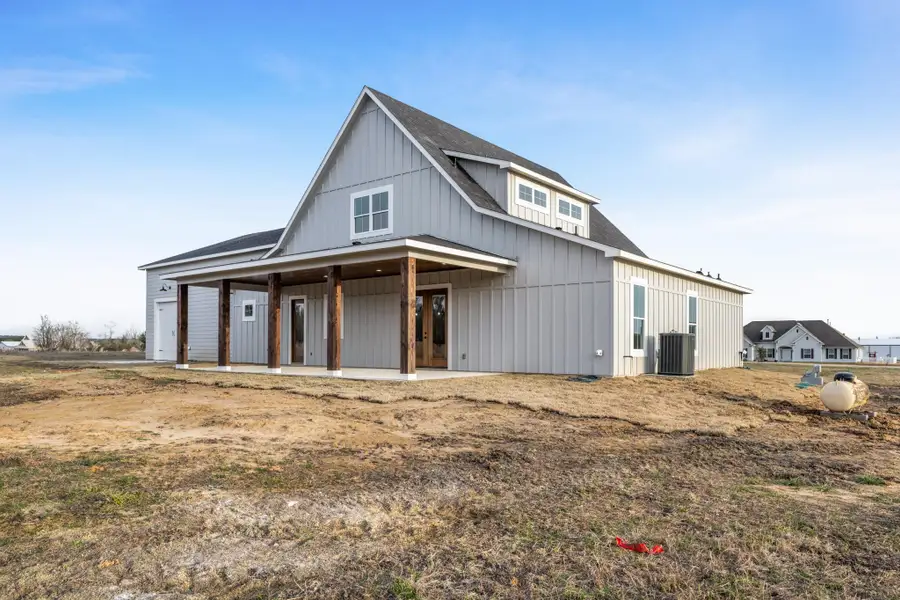 Exterior details and patio area of a home in , New Waverly (Image 4).