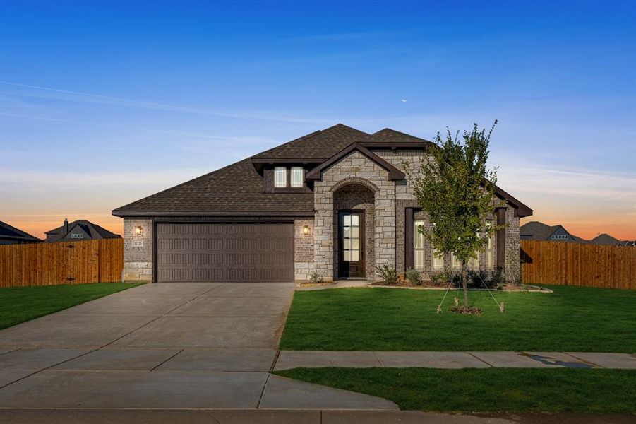 Front exterior of a new home in Coyote Crossing, Godley, TX, highlighting curb appeal (Image 2).