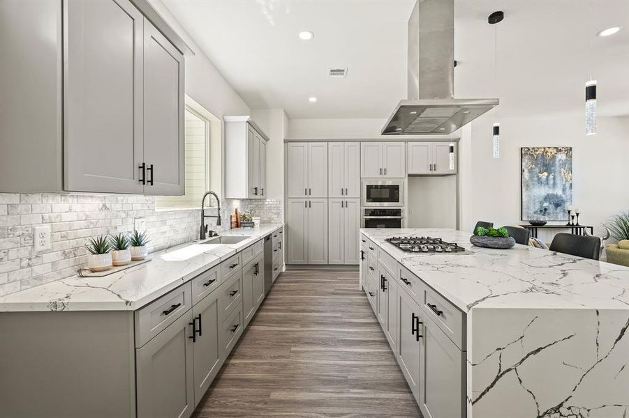 A chef's delight awaits you in this modern kitchen! Stainless steel appliances, quartz countertops, and ample cabinet space make meal preparation a breeze. Create culinary masterpieces while staying connected to those who matter most