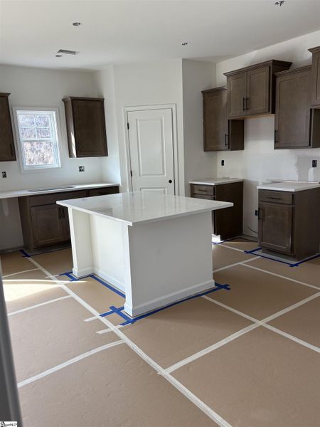 Large island work space with corner pantry Large island work space with corner pantry