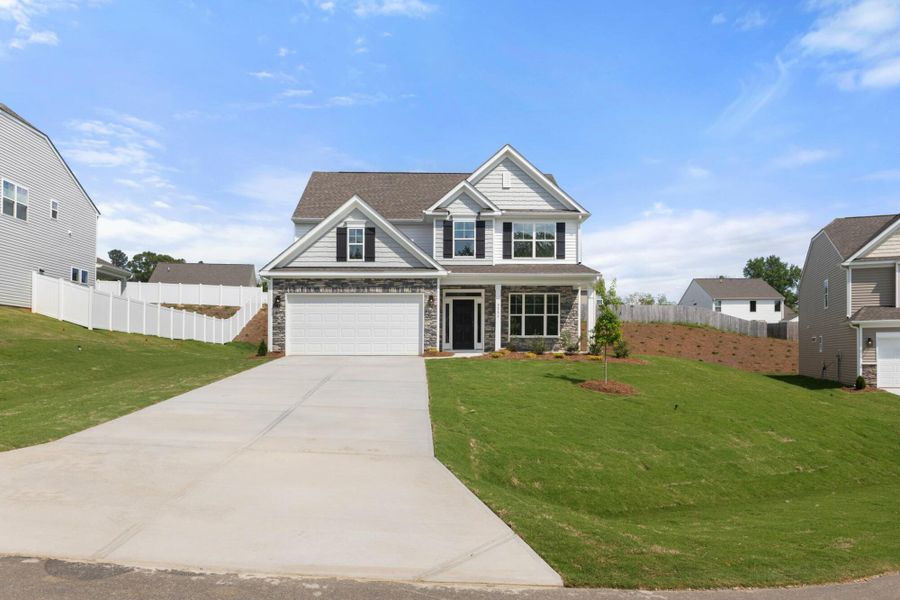 Front exterior of a new home in Cottages at Piper Village, Trinity, NC, highlighting curb appeal (Image 2).