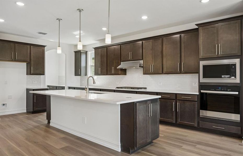 Spacious kitchen with eat-in bartop island