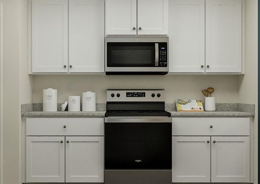 Rendering of the kitchen showcasing the
  white cabinetry, granite countertops and stainless steel appliances.