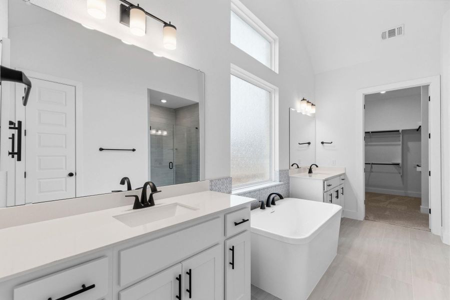 Primary Bath retreat with dual vanities & soaking tub