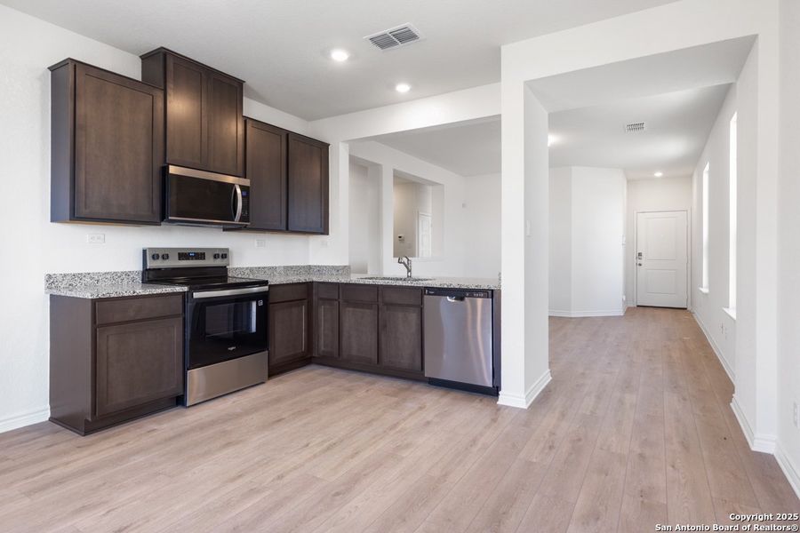 Furnished interior view inside a new home in Preserve at Culebra - Heritage Collection, San Antonio (Image 5).
