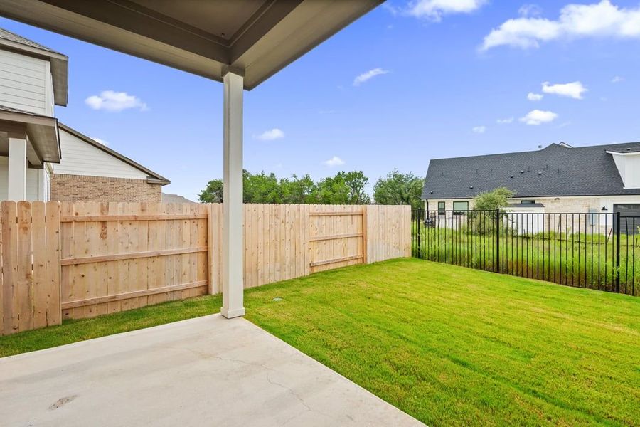 Front exterior of a new home in Terrace Collection at Lariat, Liberty Hill, TX, highlighting curb appeal (Image 25). Front exterior of a new home in Terrace Collection at Lariat, Liberty Hill, TX, highlighting curb appeal (Image 25).