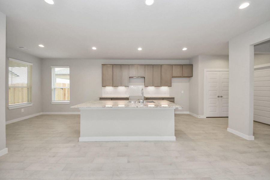 This generously spacious kitchen is a dream realized! Sample photo of completed home with similar floor plan. Actual colors and selections may vary. This generously spacious kitchen is a dream realized! Sample photo of completed home with similar floor plan. Actual colors and selections may vary.