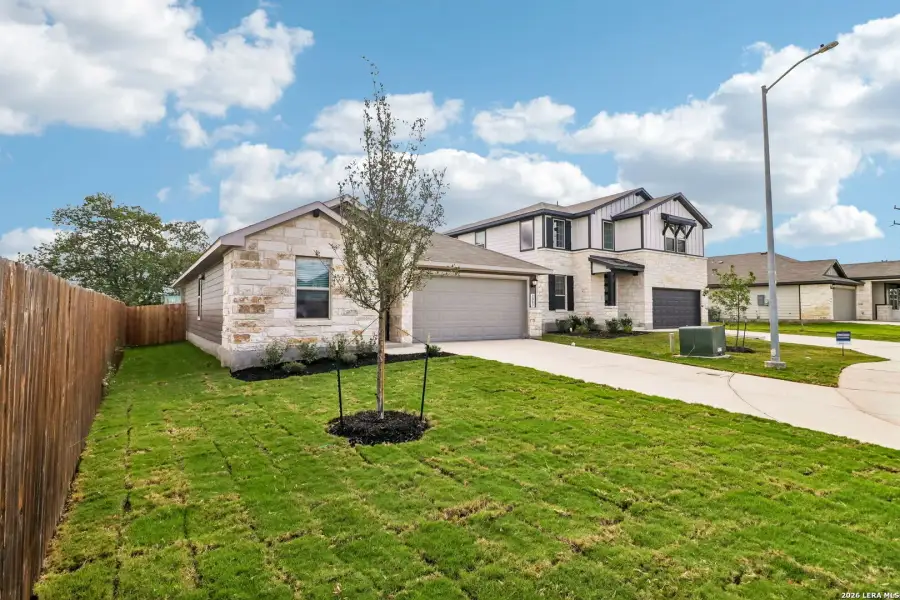 Front exterior of a new home in Catalina, Converse, TX, highlighting curb appeal (Image 23). Front exterior of a new home in Catalina, Converse, TX, highlighting curb appeal (Image 23).