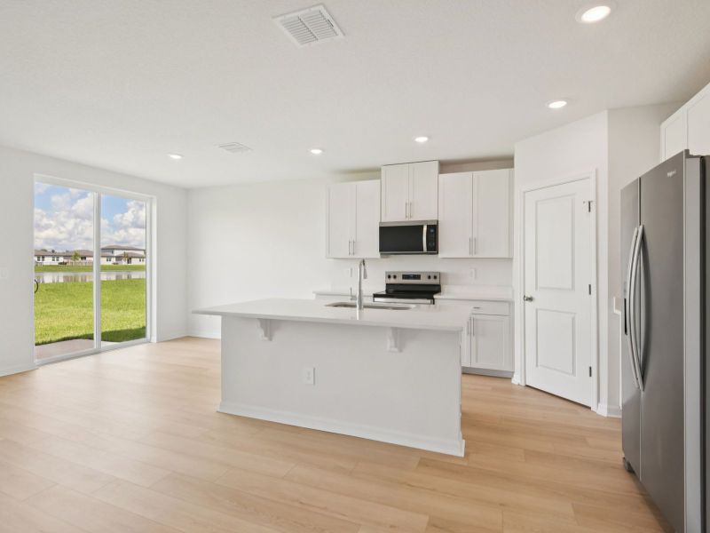 Furnished interior view inside a new home in The Grove at Stuart Crossing - Classic Series, Bartow (Image 5).
