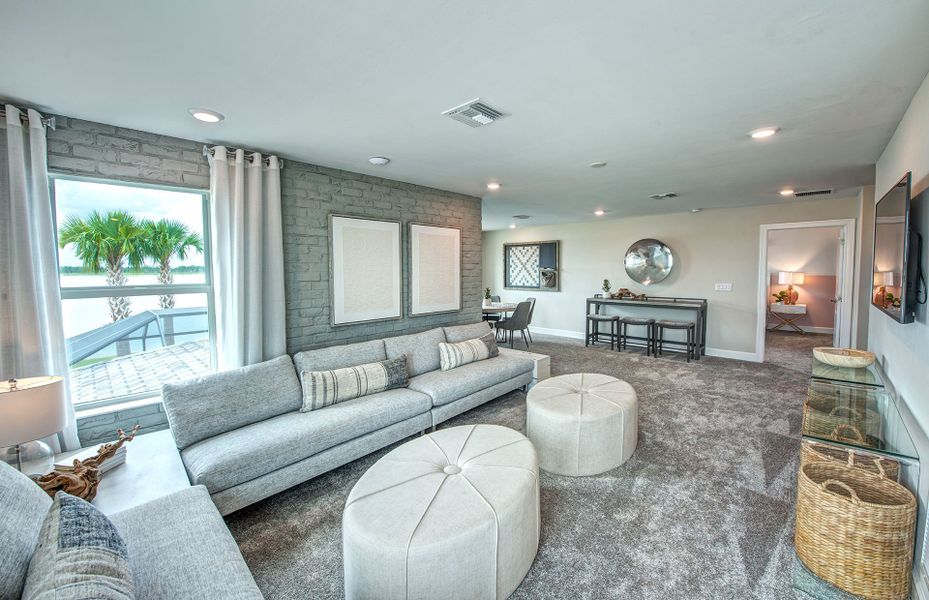 Representative furnished interior of a home built from the Mystique Grande by DiVosta in Talon Preserve on Palmer Ranch, Nokomis (Image 23).