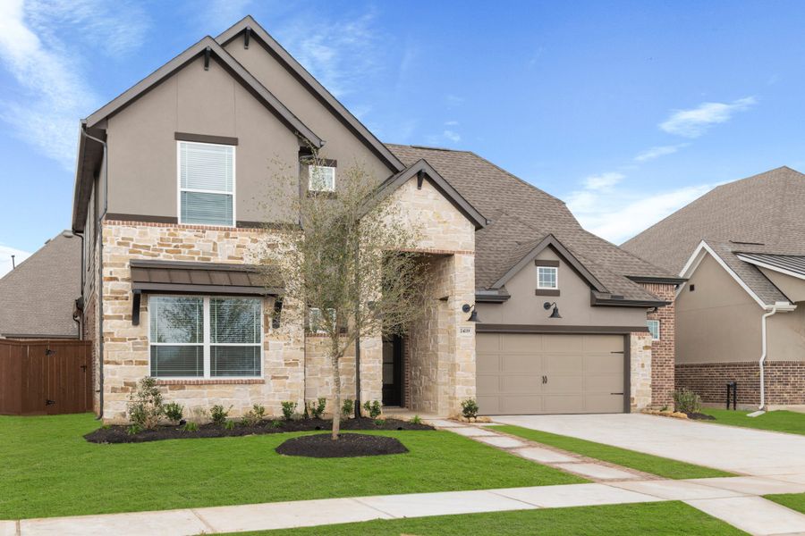 Front exterior of a new home in Elyson, Katy, TX, highlighting curb appeal (Image 26). Front exterior of a new home in Elyson, Katy, TX, highlighting curb appeal (Image 26).