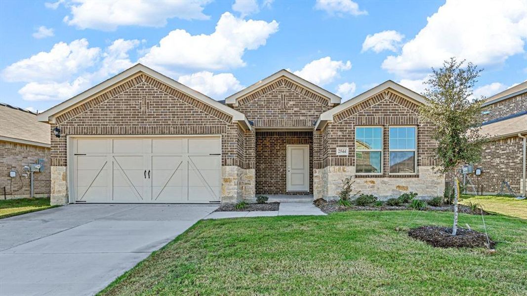 Front exterior of a new home in Cartwright Ranch, Crandall, TX, highlighting curb appeal (Image 1). Front exterior of a new home in Cartwright Ranch, Crandall, TX, highlighting curb appeal (Image 1).