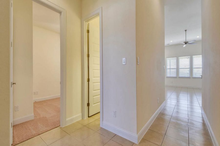 Representative unfurnished interior of a home built from the Oaks 1596 by Brohn Homes in Oaks at San Gabriel, Georgetown (Image 10).