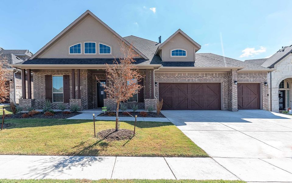 Front exterior of a new home in Sonoma Verde, Rockwall, TX, highlighting curb appeal (Image 1). Front exterior of a new home in Sonoma Verde, Rockwall, TX, highlighting curb appeal (Image 1).