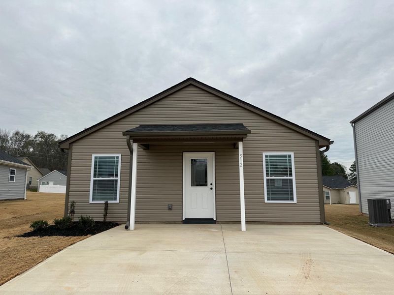 Front exterior of a new home in Gentry Place, Spartanburg, SC, highlighting curb appeal (Image 1). Front exterior of a new home in Gentry Place, Spartanburg, SC, highlighting curb appeal (Image 1).