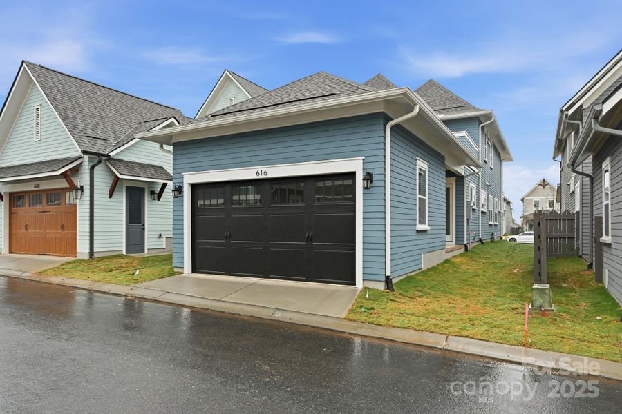 Private rear-entry two car garage with alley access, offering easy entry and added curb appeal. Private rear-entry two car garage with alley access, offering easy entry and added curb appeal.