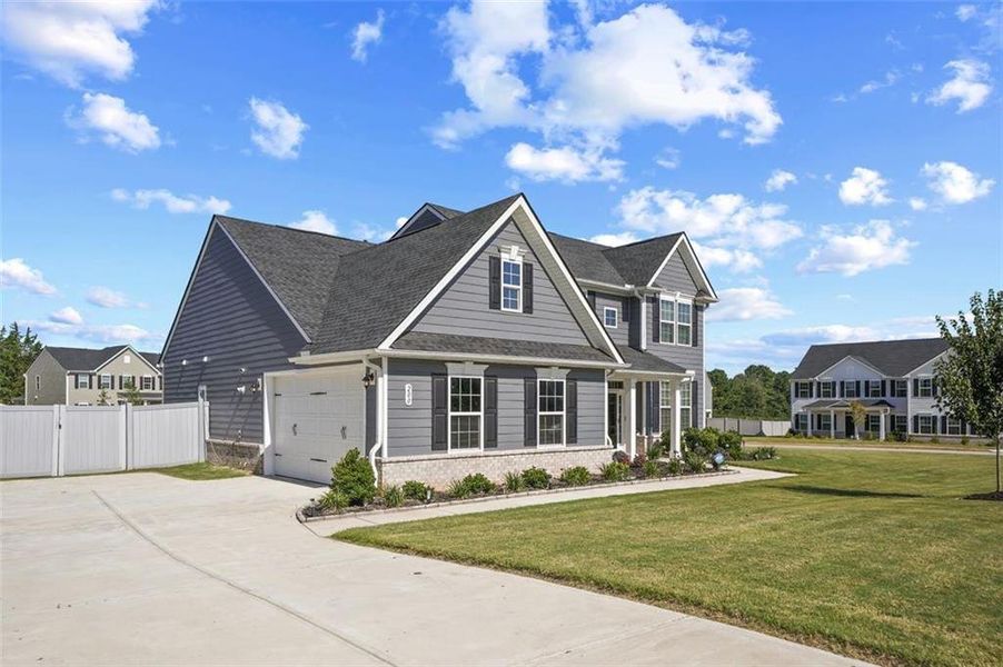 Front exterior of a new home in , Locust Grove, GA, highlighting curb appeal (Image 23).