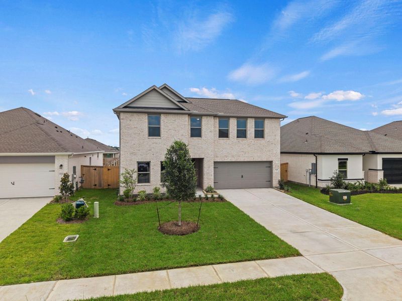 Front exterior of a new home in Windrose Green, Angleton, TX, highlighting curb appeal (Image 17).