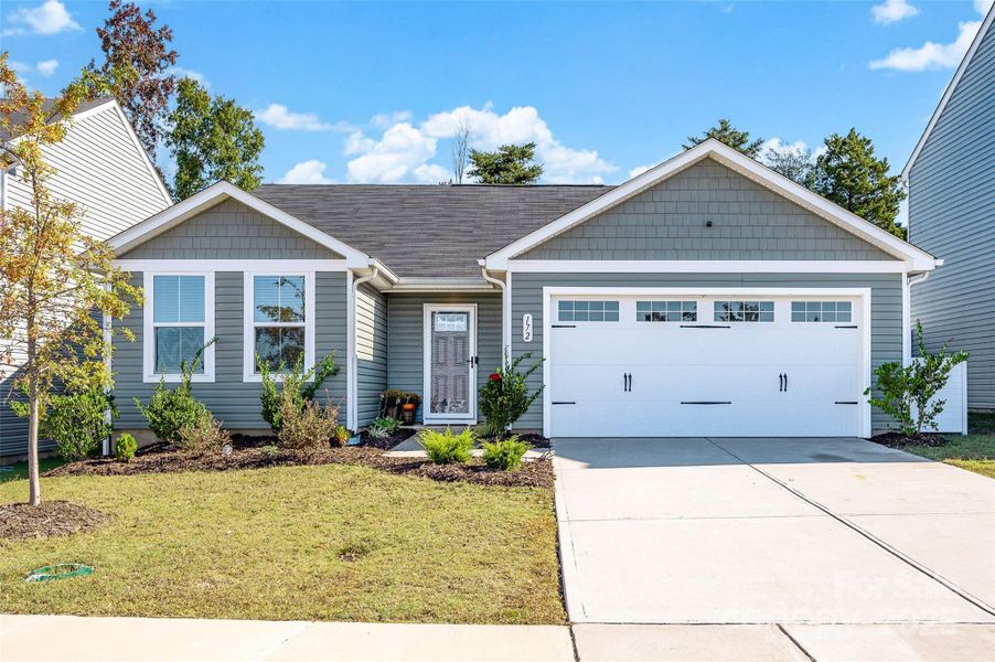 Front exterior of a new home in , Troutman, NC, highlighting curb appeal (Image 2).