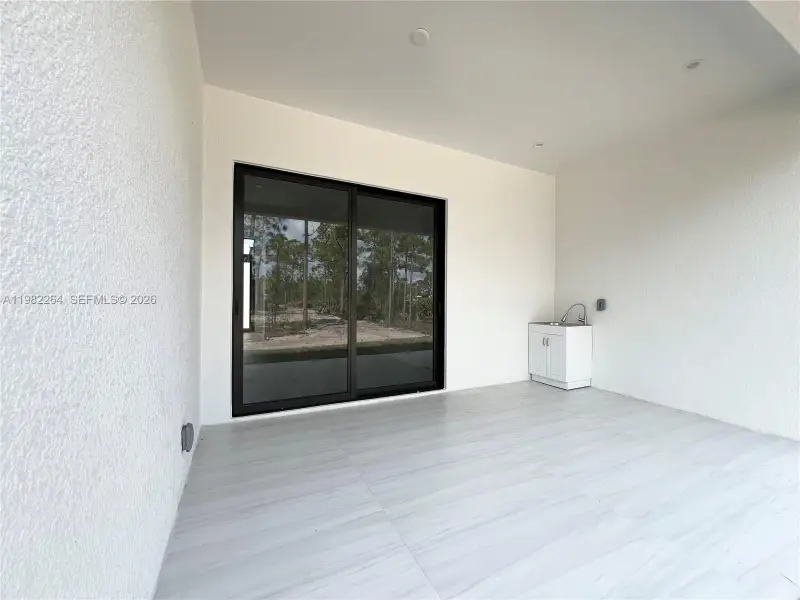 Exterior details and patio area of a home in , Naples (Image 3). Exterior details and patio area of a home in , Naples (Image 3).