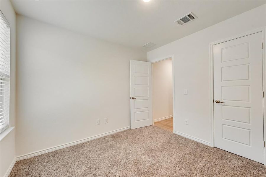 Ranch-style home featuring a front lawn, concrete driveway, and brick siding Ranch-style home featuring a front lawn, concrete driveway, and brick siding