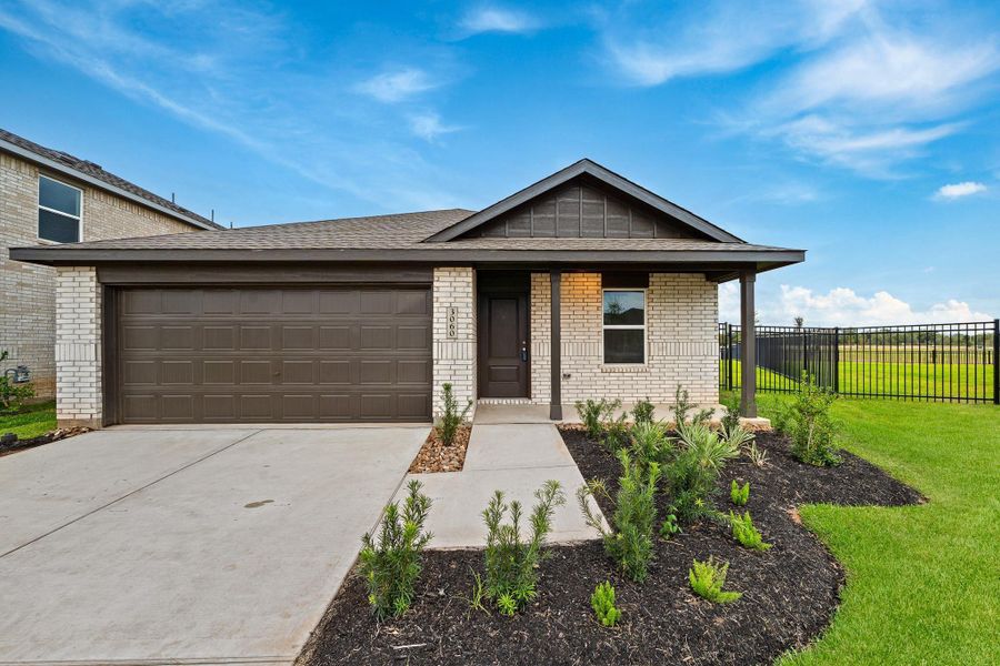 Front exterior of a new home in Sunterra, Katy, TX, highlighting curb appeal (Image 2). Front exterior of a new home in Sunterra, Katy, TX, highlighting curb appeal (Image 2).