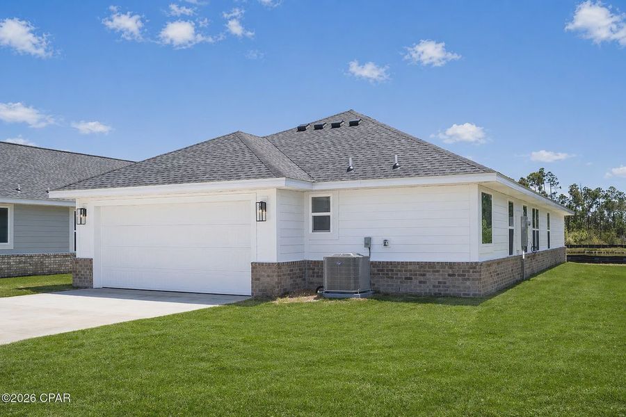 Front exterior of a new home in East Bay, Panama City, FL, highlighting curb appeal (Image 14).