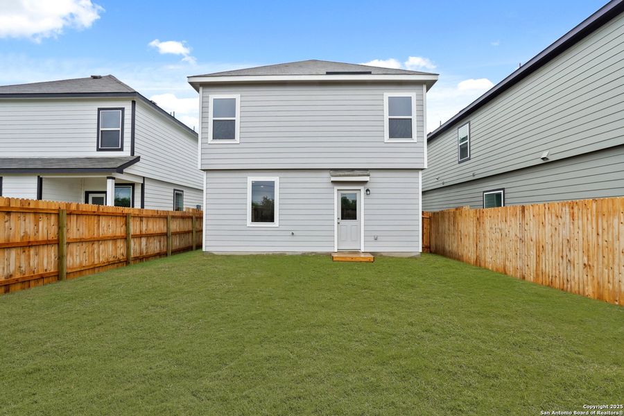Front exterior of a new home in Melissa Ranch, San Antonio, TX, highlighting curb appeal (Image 2).