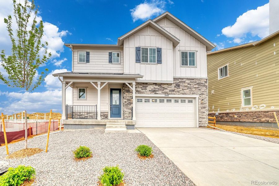 Front exterior of a new home in Harvest Crossing, Aurora, CO, highlighting curb appeal (Image 2). Front exterior of a new home in Harvest Crossing, Aurora, CO, highlighting curb appeal (Image 2).