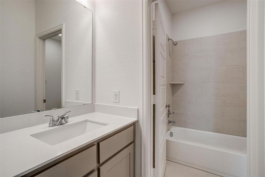 Full Bathroom located upstairs. Each bedroom has their own sink area