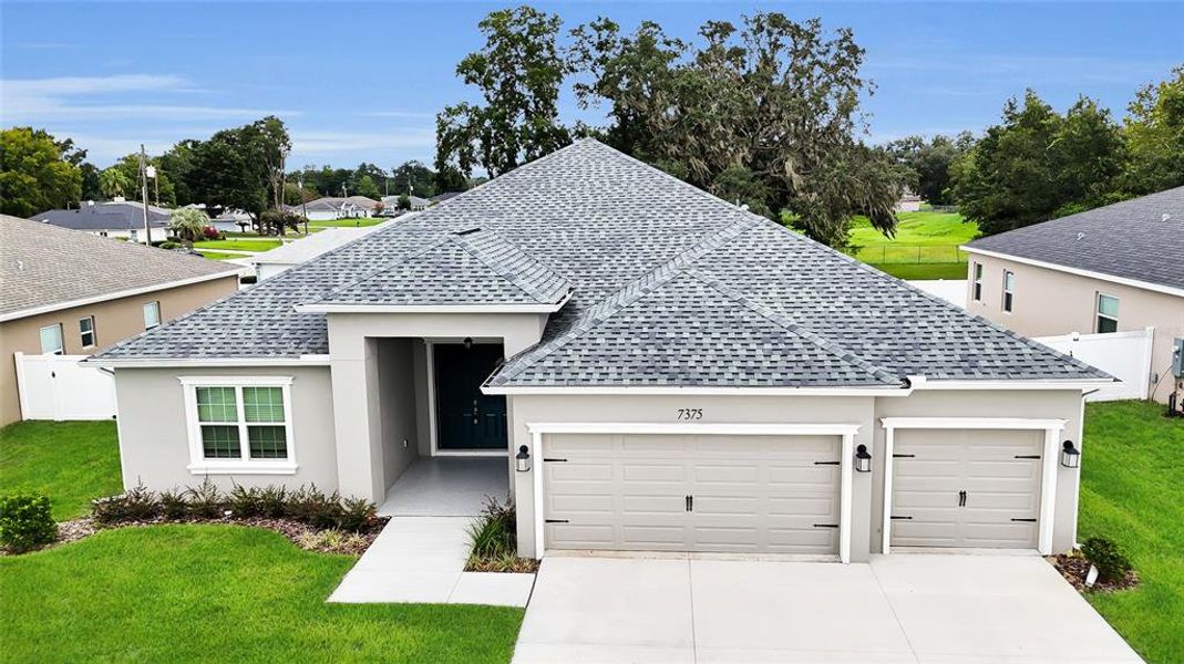 Front exterior of a new home in , Ocala, FL, highlighting curb appeal (Image 32).