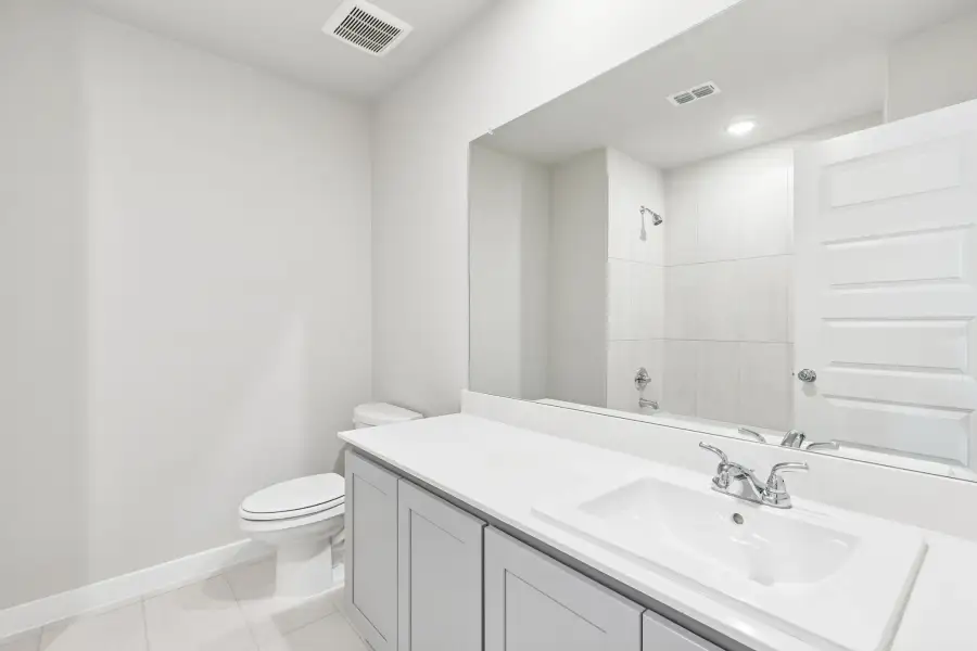 Bathroom in the Haylee home plan by Trophy Signature Homes - REPRESENTATIVE PHOTO