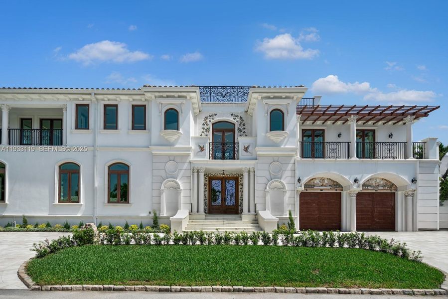 Front exterior of a new home in , Surfside, FL, highlighting curb appeal (Image 2). Front exterior of a new home in , Surfside, FL, highlighting curb appeal (Image 2).