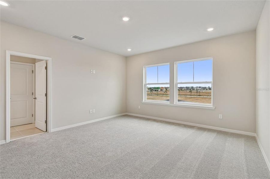 Spacious, unfurnished interior of a new home in Laureate Park at Lake Nona - Garden Series, Orlando (Image 24).