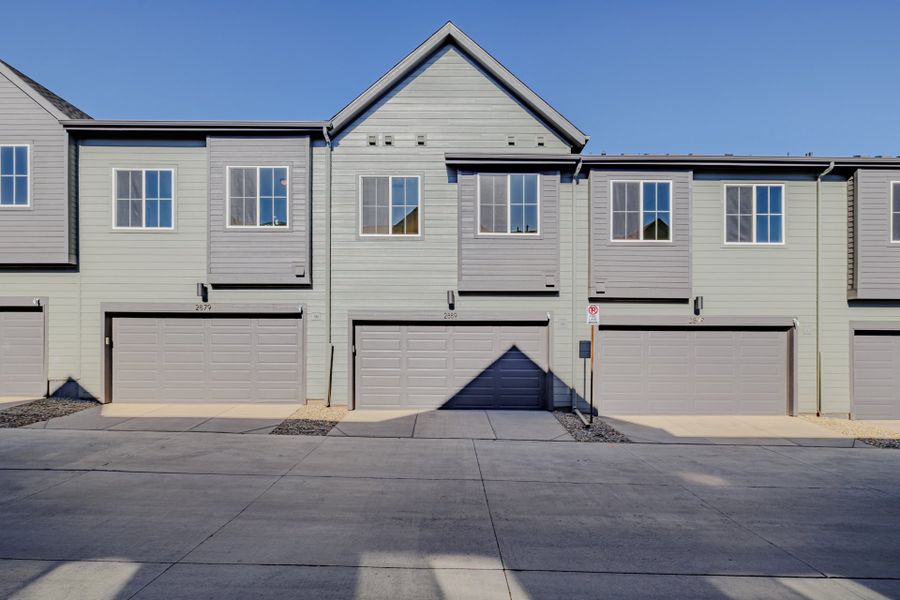 Front exterior of a new home in Arras Park, Thornton, CO, highlighting curb appeal (Image 19).
