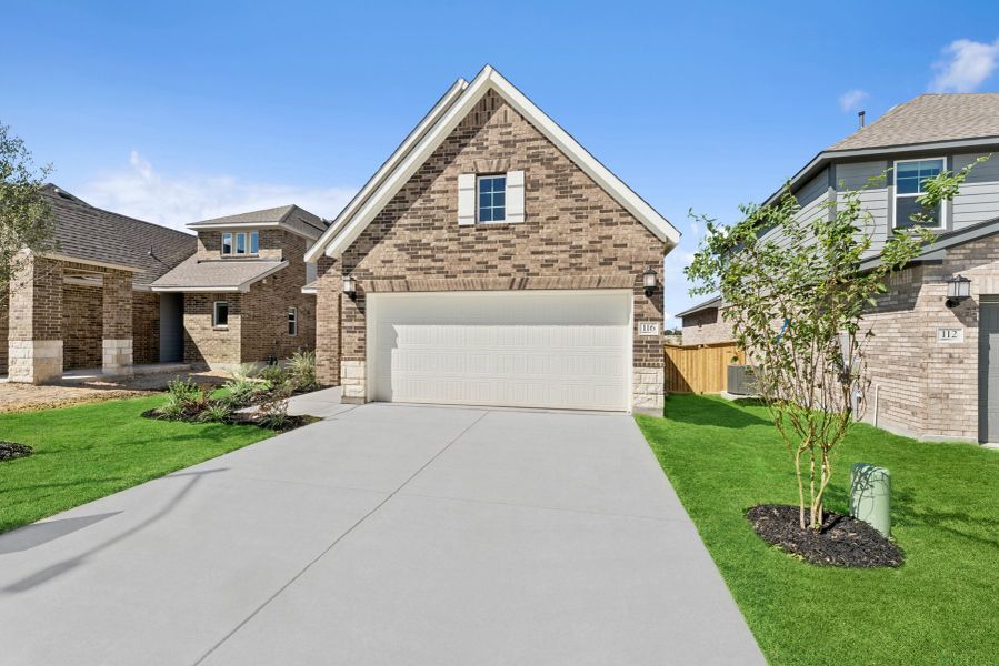 Front exterior of a new home in Mayfair - Select Garden Series, New Braunfels, TX, highlighting curb appeal (Image 19). Front exterior of a new home in Mayfair - Select Garden Series, New Braunfels, TX, highlighting curb appeal (Image 19).