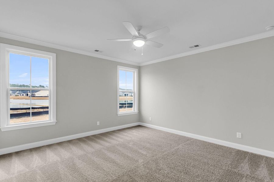 Spacious, unfurnished interior of a new home in Tidewater at Lakes of Cane Bay, Summerville (Image 34).