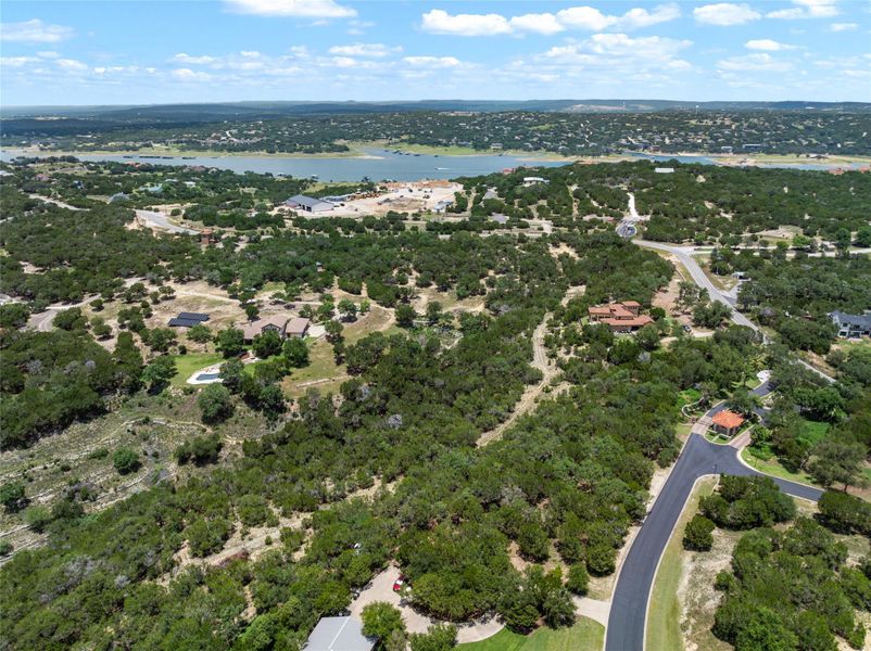 Vast, verdant landscape unfolds towards a distant lake, offering serene vistas and privacy. Vast, verdant landscape unfolds towards a distant lake, offering serene vistas and privacy.