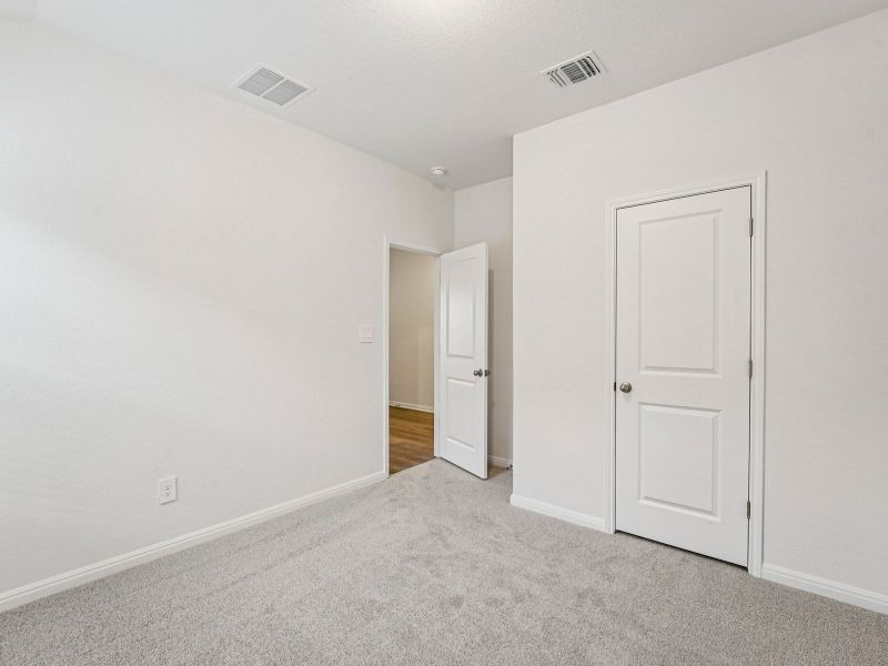 Spacious, unfurnished interior of a new home in Prairie Winds - Boulevard Collection, Hutto (Image 9).