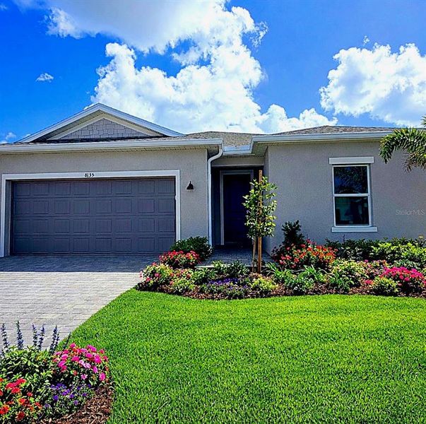 Front exterior of a new home in , Englewood, FL, highlighting curb appeal (Image 13).