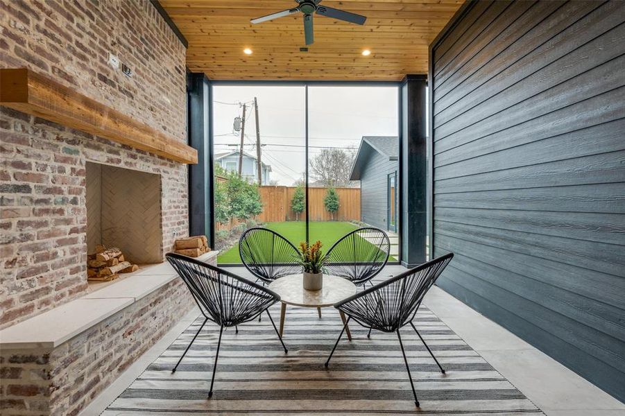 Sunroom / solarium featuring wooden ceiling and ceiling fan