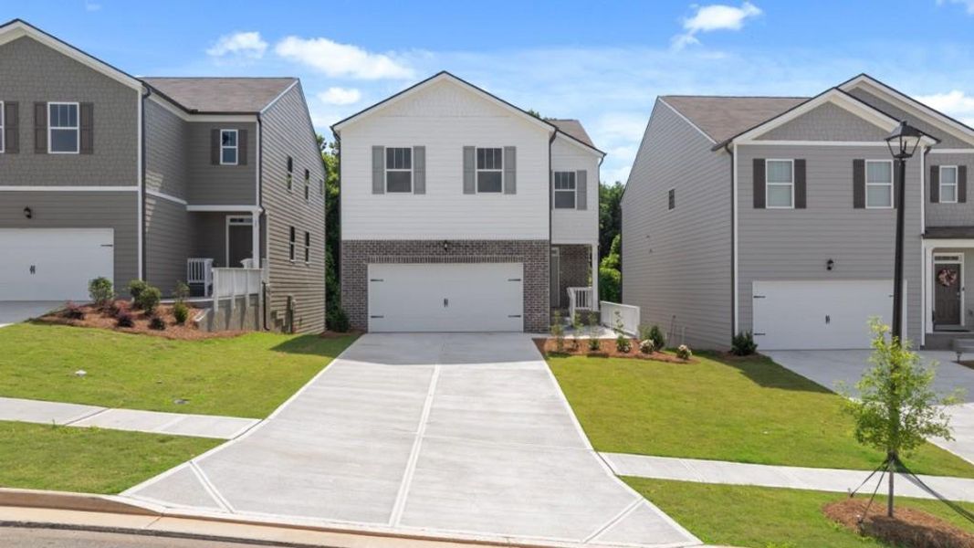 Front exterior of a new home in Rolling Meadows, Jasper, GA, highlighting curb appeal (Image 1). Front exterior of a new home in Rolling Meadows, Jasper, GA, highlighting curb appeal (Image 1).