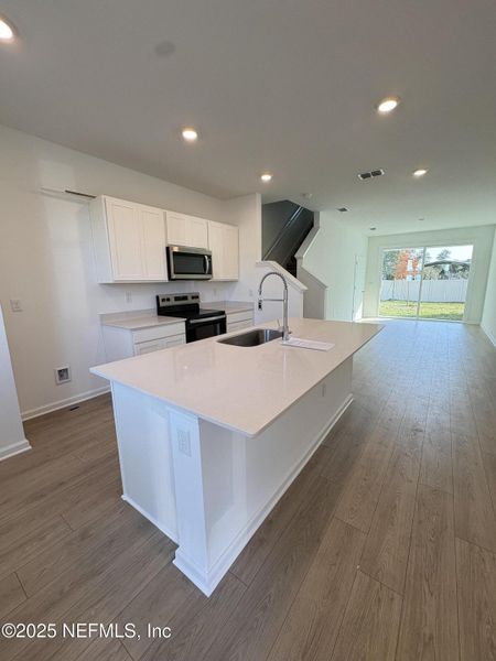 Furnished interior view inside a new home in Cordera Townhomes, St. Augustine (Image 8).