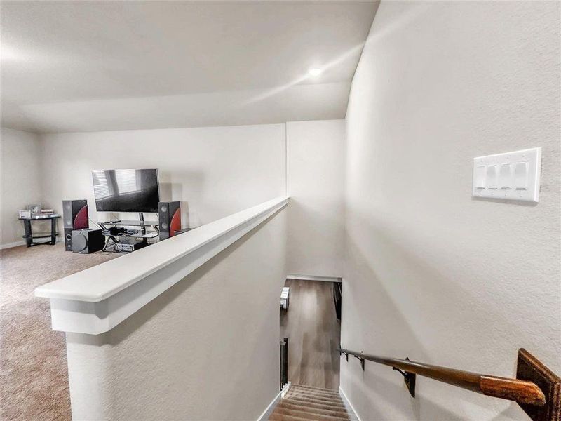 Spacious and light-filled living room featuring an open-concept layout, high ceilings, and seamless flow into the kitchen and dining areas—perfect for everyday living and entertaining.