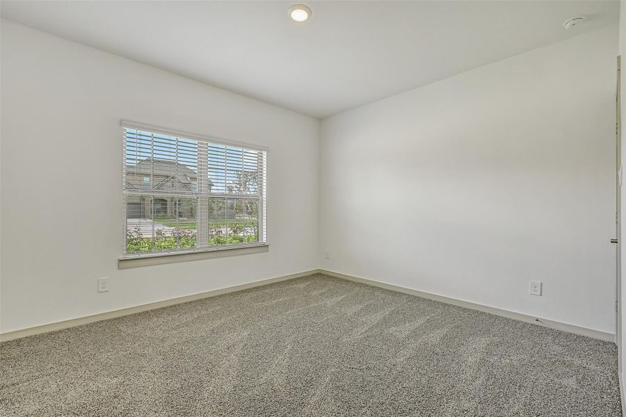 Another secondary bedroom offers plush neutral carpet, a large front-facing window and a versatile blank canvas ready to accommodate a variety of furnishings and uses. Another secondary bedroom offers plush neutral carpet, a large front-facing window and a versatile blank canvas ready to accommodate a variety of furnishings and uses.