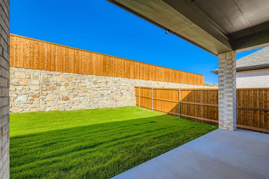 Fenced backyard featuring a patio area