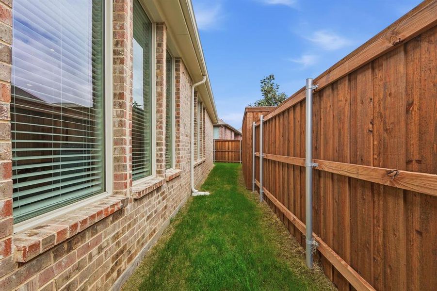 Exterior details and patio area of a home in Elements at Viridian | Active Adult 55+, Arlington (Image 23).