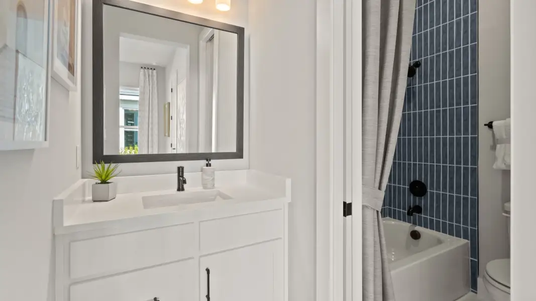 Furnished interior view inside a new home in Glynlea Country Club, Port St. Lucie (Image 19).