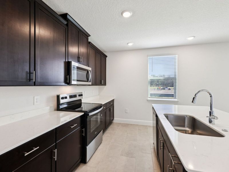 Furnished interior view inside a new home in The Reserve at Hammock Oaks - Signature Series, Lady Lake (Image 5).