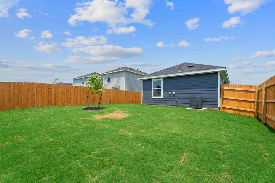 View of yard featuring central air condition unit and a fenced backyard View of yard featuring central air condition unit and a fenced backyard